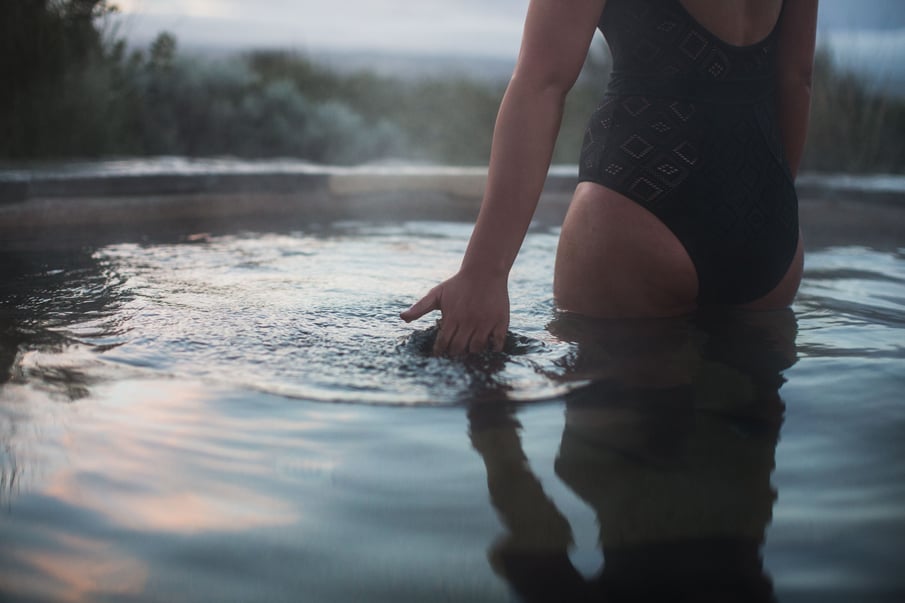 A person moving their hand through water