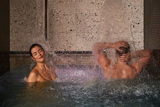 Two people bathing at Aurora Spa & Bathhouse