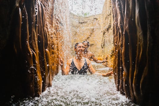 Two people walking through hot springs at Deep Blue Spa & Baths