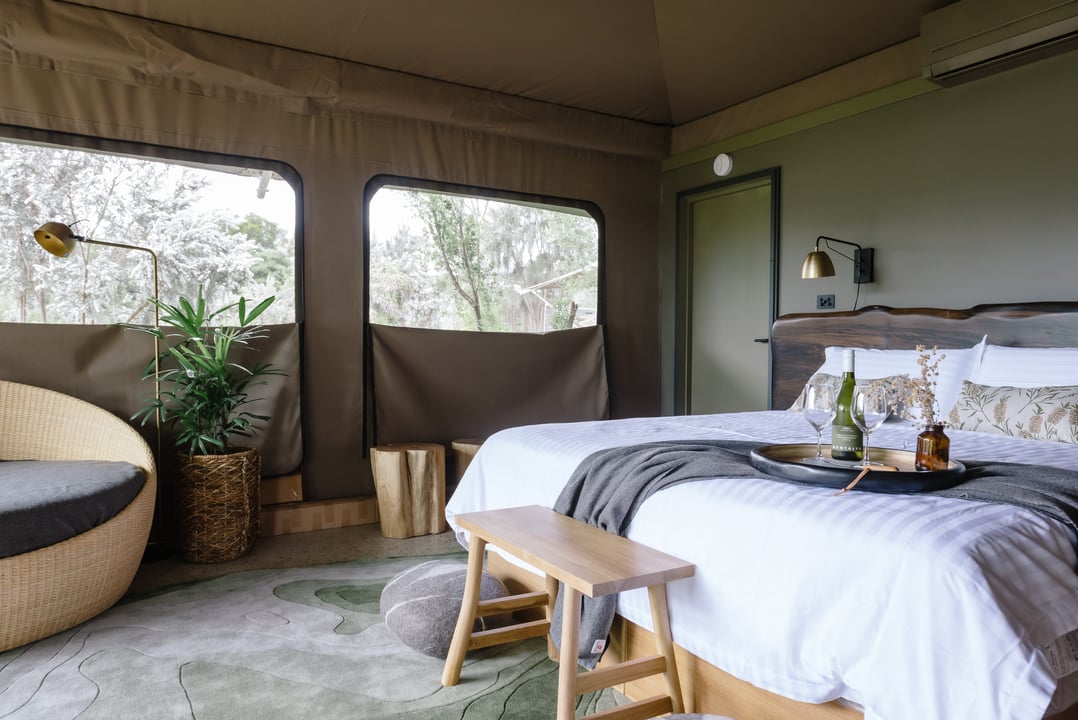 A glamping bed in a tent