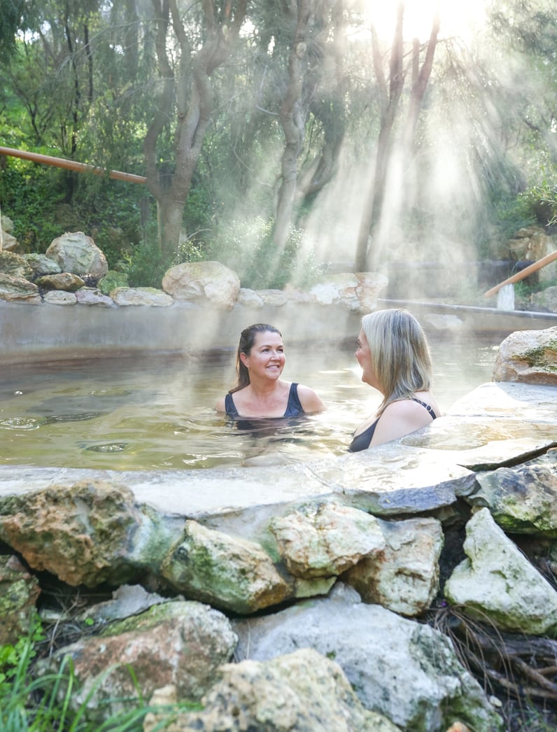 Two people bathing in the bathing gully