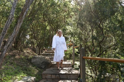 Women walking in white robes through the Spa Dreaming Centre